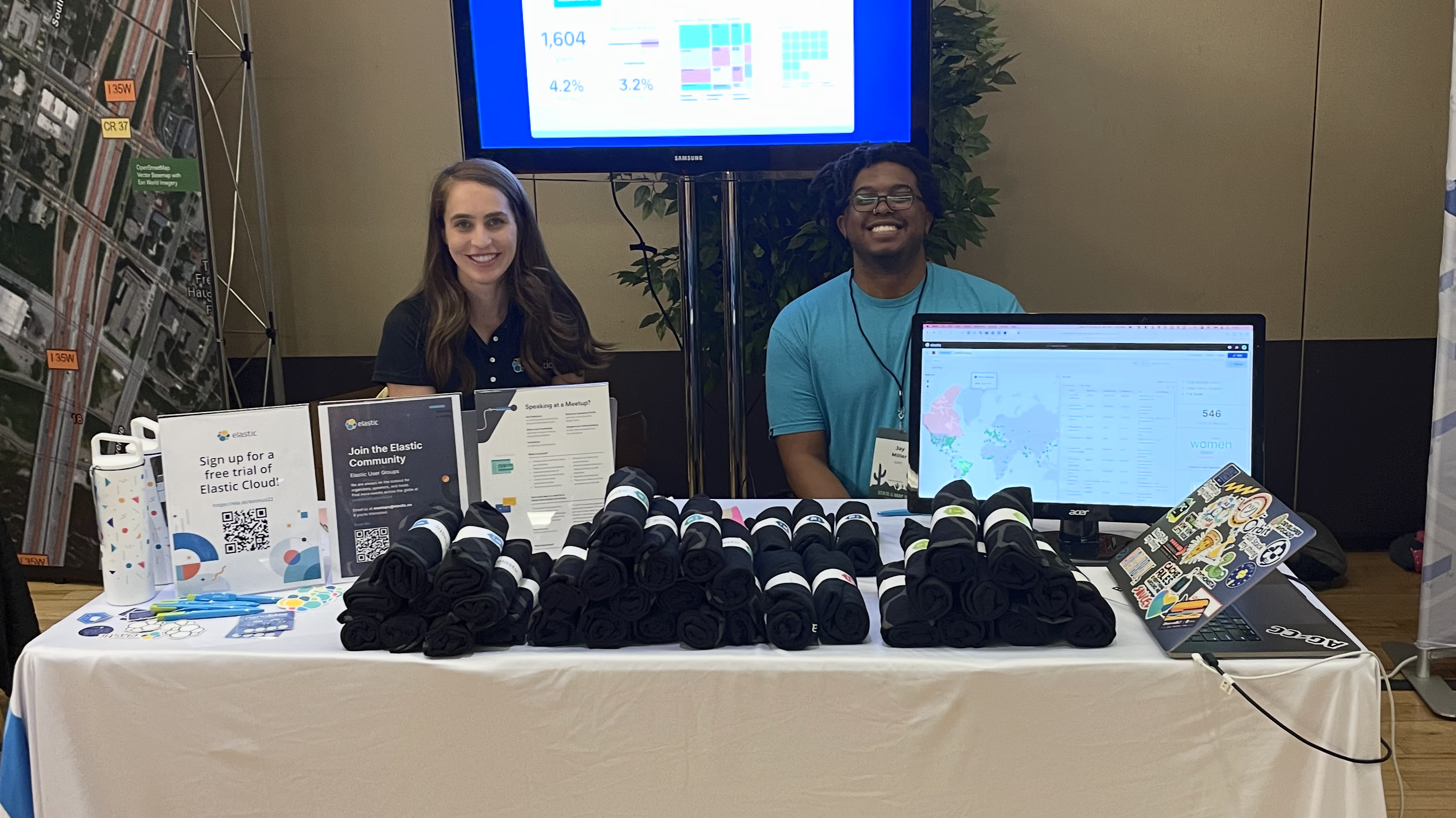 Photo of me at the Elastic Booth at State of the Maps
